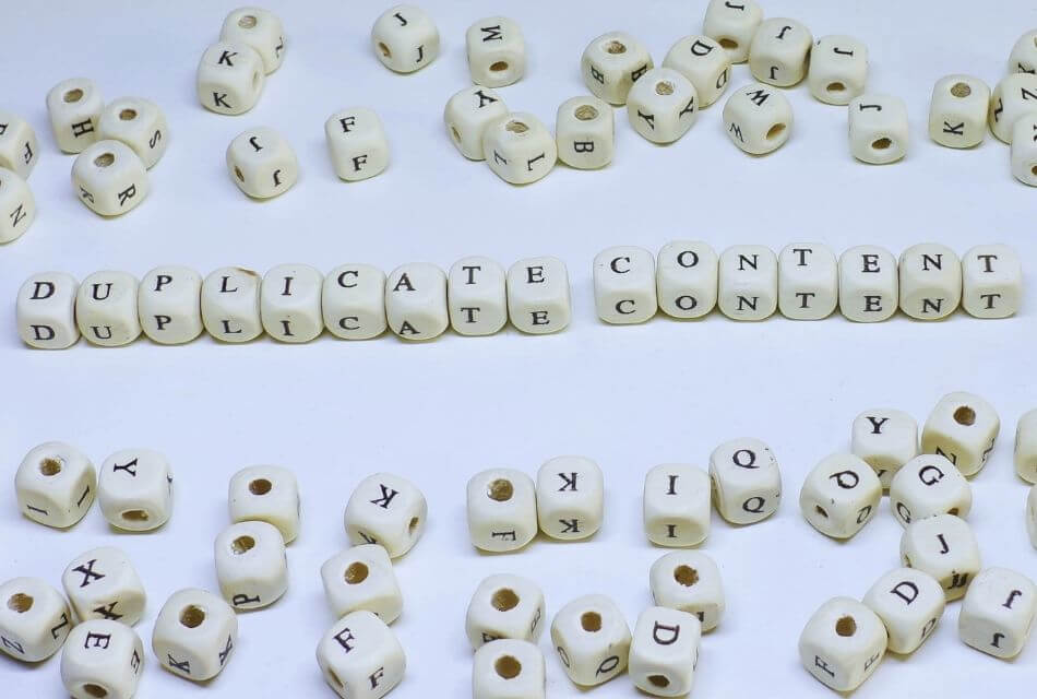 Duplicate Content spelled out with dice on a light-blue background
