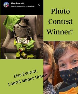 PHoto contest winner - little robot man made of conference swag and photo of winner.