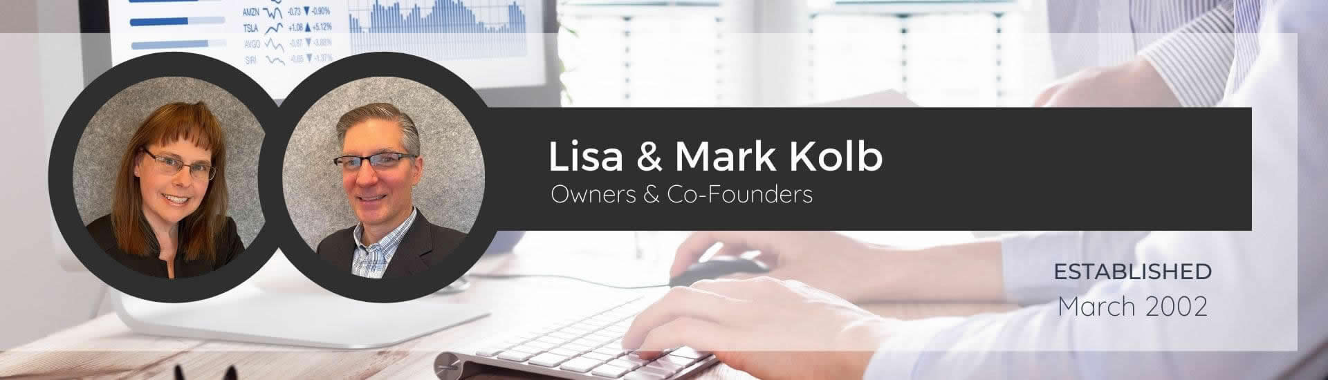 Lisa and Mark Kolb, Owners and Co-Founders for Acorn Marketing, on a background of a desktop monitor and keyboard on a desk.