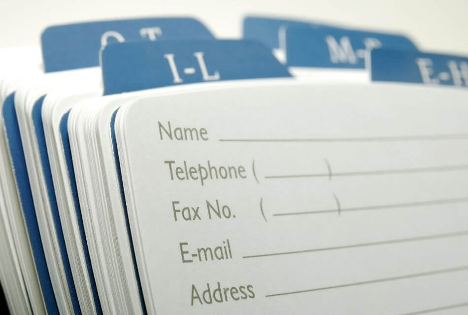 Rolodex with blue tabs and basic information on card